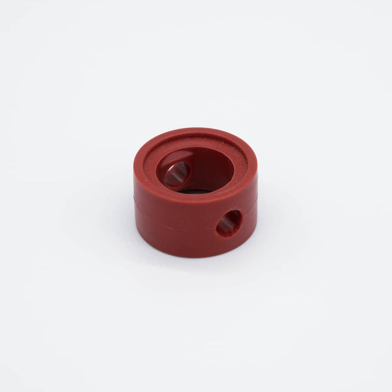 Orange SIlicone seat replacement seal for a one inch butterfly valve. Angled to display the band width. Photo credit: TCfittings.com.